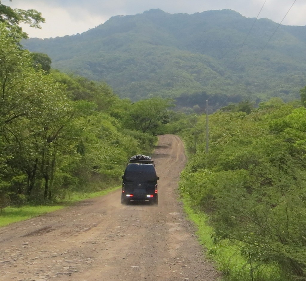 Driving down a dirt road in a mountainous area