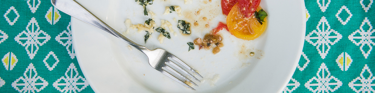 plate with leftover food and fork