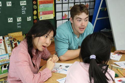 Chinese students teaching elem students 