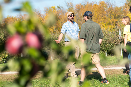 Meeting with students in the orchard