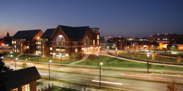 a long exposure of the davis center exterior along main street with cars driving by