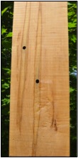 a maple board with sample holes in it