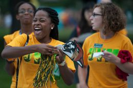 students with yellow pom-poms