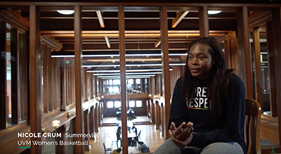 Still from video of Nicole Crum, UVM women's basketball player