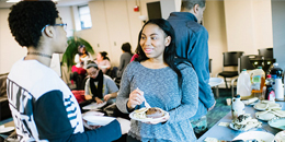 Students chat over a meal at the mosaic center for students of color
