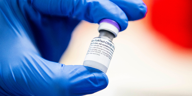 A vial of the Pfizer COVID-19 vaccine is shown before being processed to be administered to the first subjects, health care workers at the University of Vermont Medical Center, on Tuesday, Dec. 15, 2020.