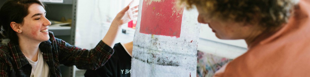 Two students admiring art