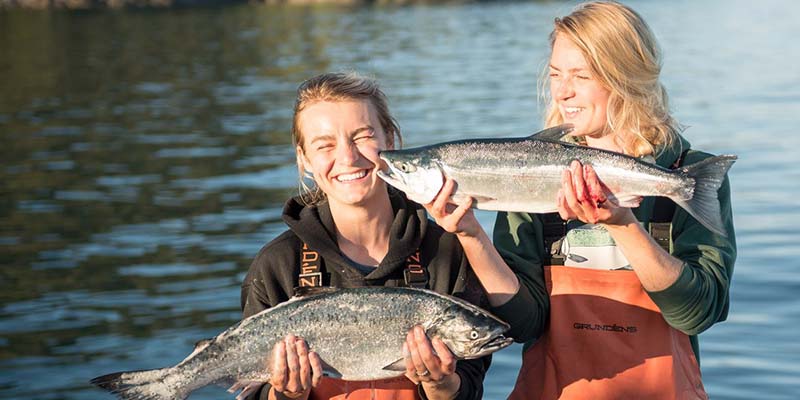 Claire Neaton (left) and sister Emma Teal Laukitis, with fish
