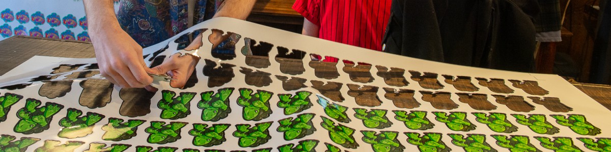 art intern with sheet of stickers