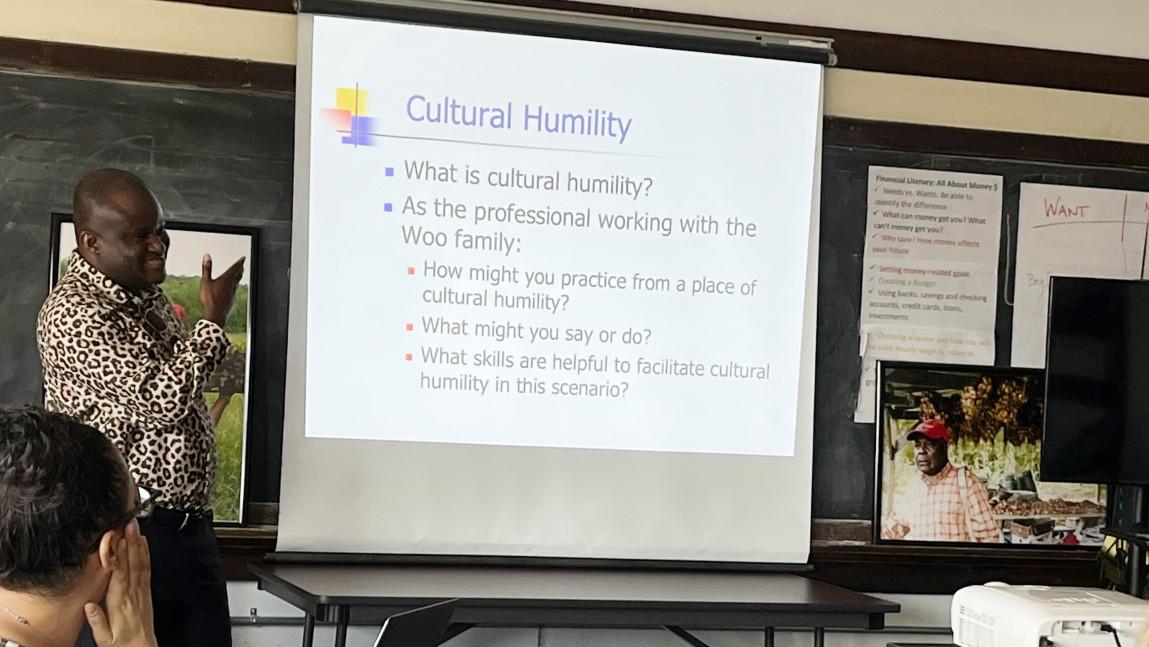 Workshop facilitator Jules Wetchi talks about about cultural humility and the Congolese community.