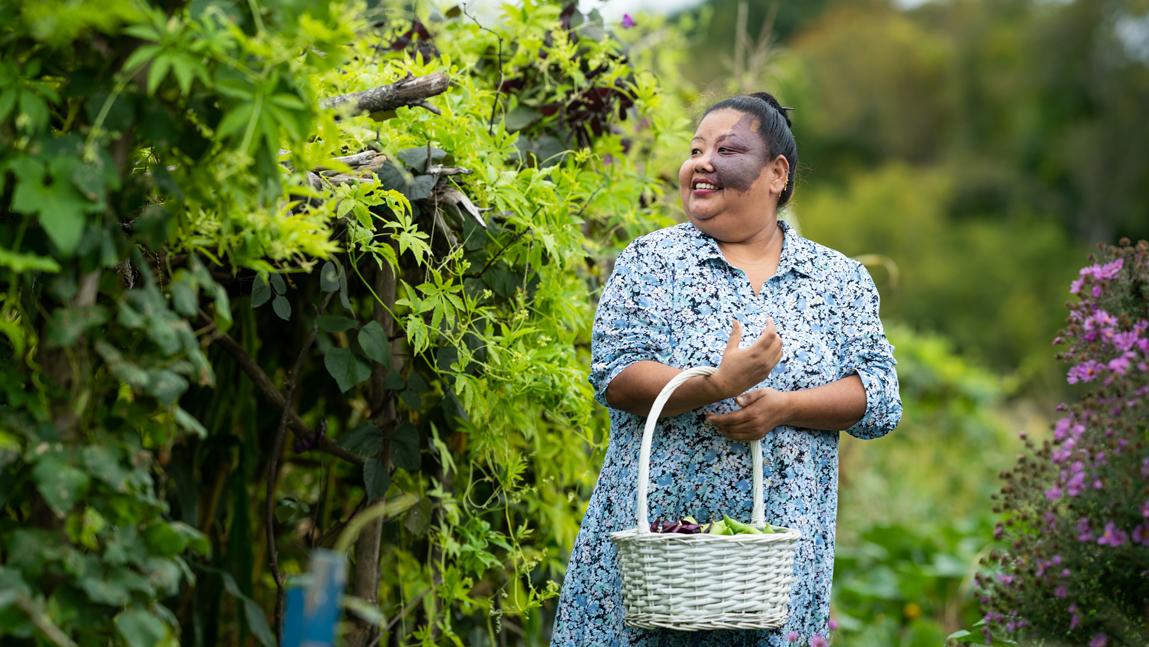 Mon Moti Rai harvests caigua and hyacinth beans.