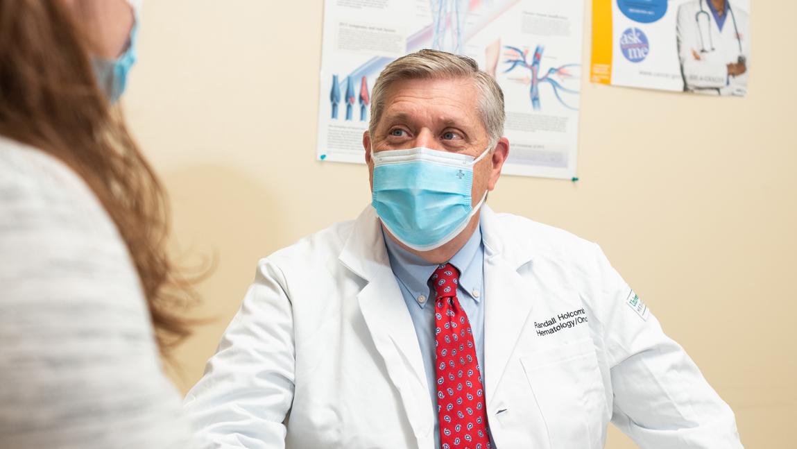 Randall F. Holcombe seeing a patient