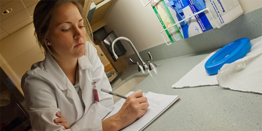 Taking notes in the research lab