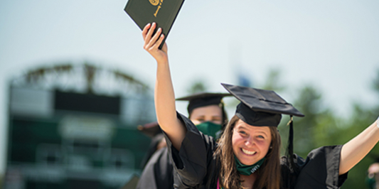 happy female graduate holding diploma