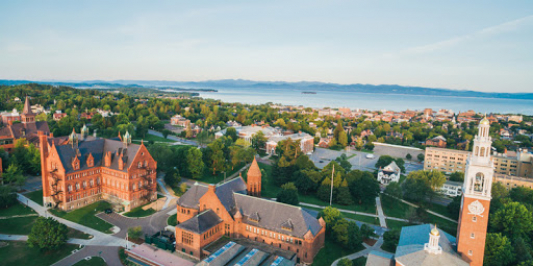 UVM's main campus with the lake in the background taken from a drone.