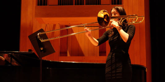 Camille playing trombone