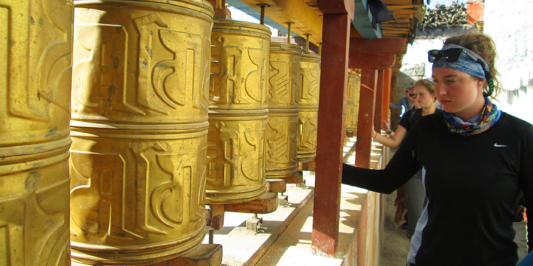 students in tibet viewing an art exhibition