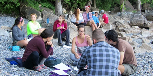 Graduate students interacting on beach
