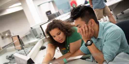  Students working together at a computer