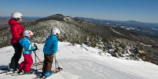 Family at top of ski slope