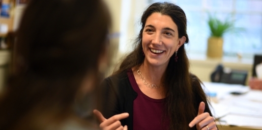Professor Shana Haines talking with a student.