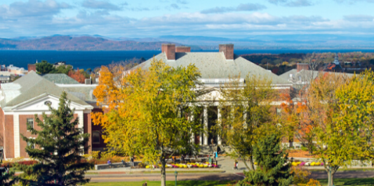 A bird's-eye view of the Waterman Building with the lake beyond.