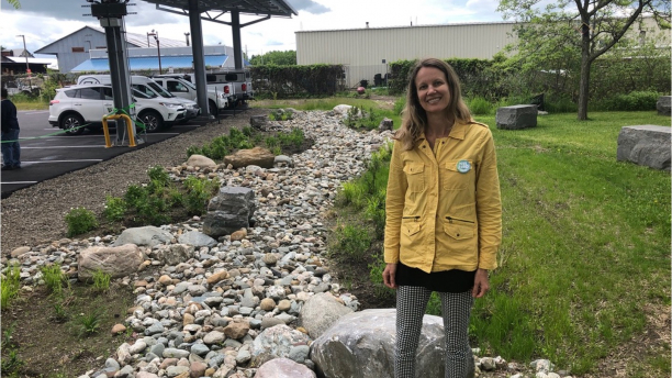 Dr Stephanie Hurley standing near her built stormwater project at the Echo Ctr, Burlington VT