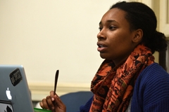 Human Development and Family Studies student writing at a desk