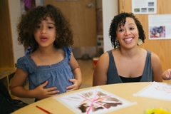 Young child and student teacher at the Campus Children's School