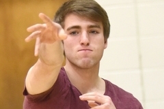 Physical Education student throwing a ball