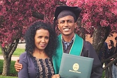 Social Work graduate Eyob and his mother at Commencement