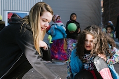 Student working with youth at King Street Center