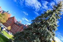Student biking on UVM path