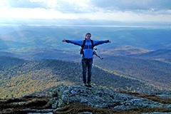 Student on mountain top