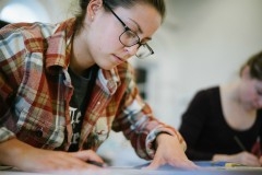 artist examining portfolio