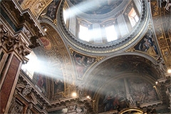 Looking up from the apse at an ornate ceiling