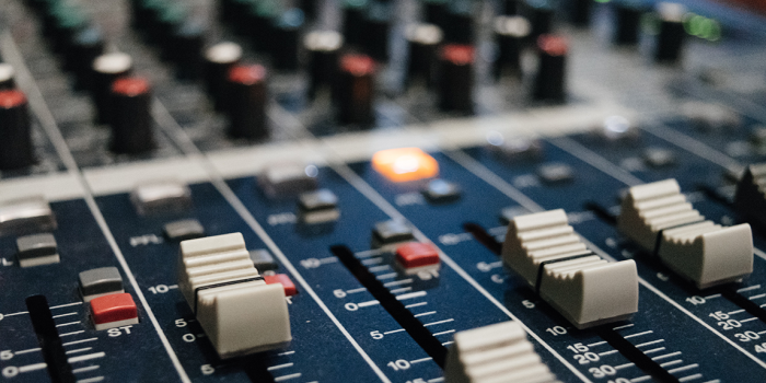 image of a mixing board used in a recording studio