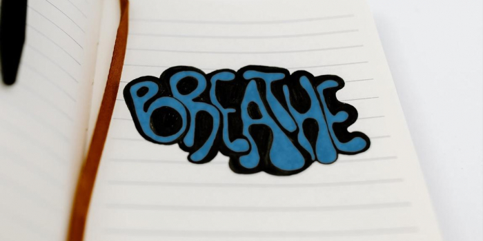 the word breathe in bubble letters on a piece of paper