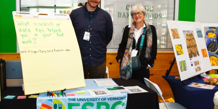 Polly Ericksen and Andrew may at their booth at the FINE conference. 