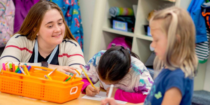 Sarah Bassett works with students at Orchard Elementary School