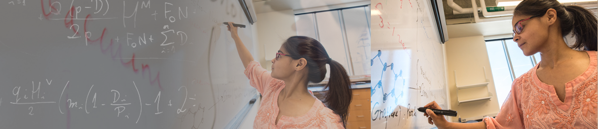 Working out a mathematics problem on the whiteboard