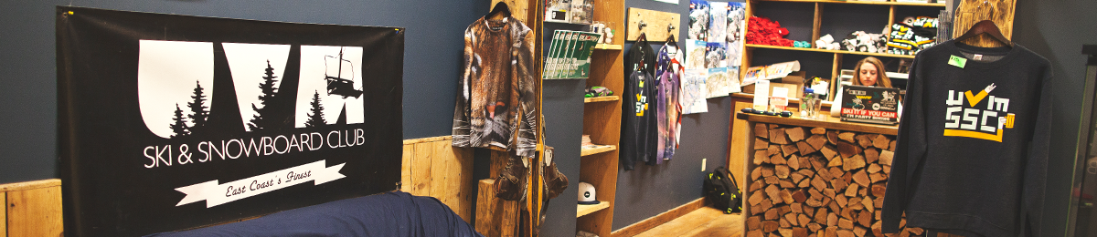 A student worker sits at a counter in the The Ski & snowboard clubhaus