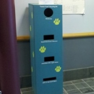 Technotrash disposal station for batteries, bulbs and small electronic devices.