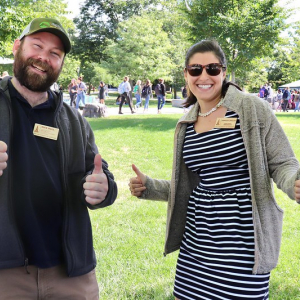 Two Staff Council Representatives give the thumbs up.