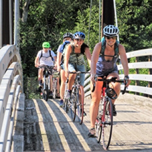 Bikers on wooden bridge