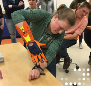 Student with biomedically engineered hand