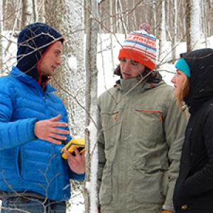 Students using GPS in forest