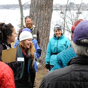 People talking in group near lake