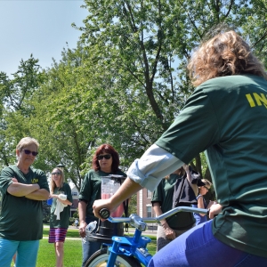 Wellness Event with person riding smoothie bike.