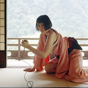 Pixy Liao crouching on hands and knees on a carpeted porch type setting